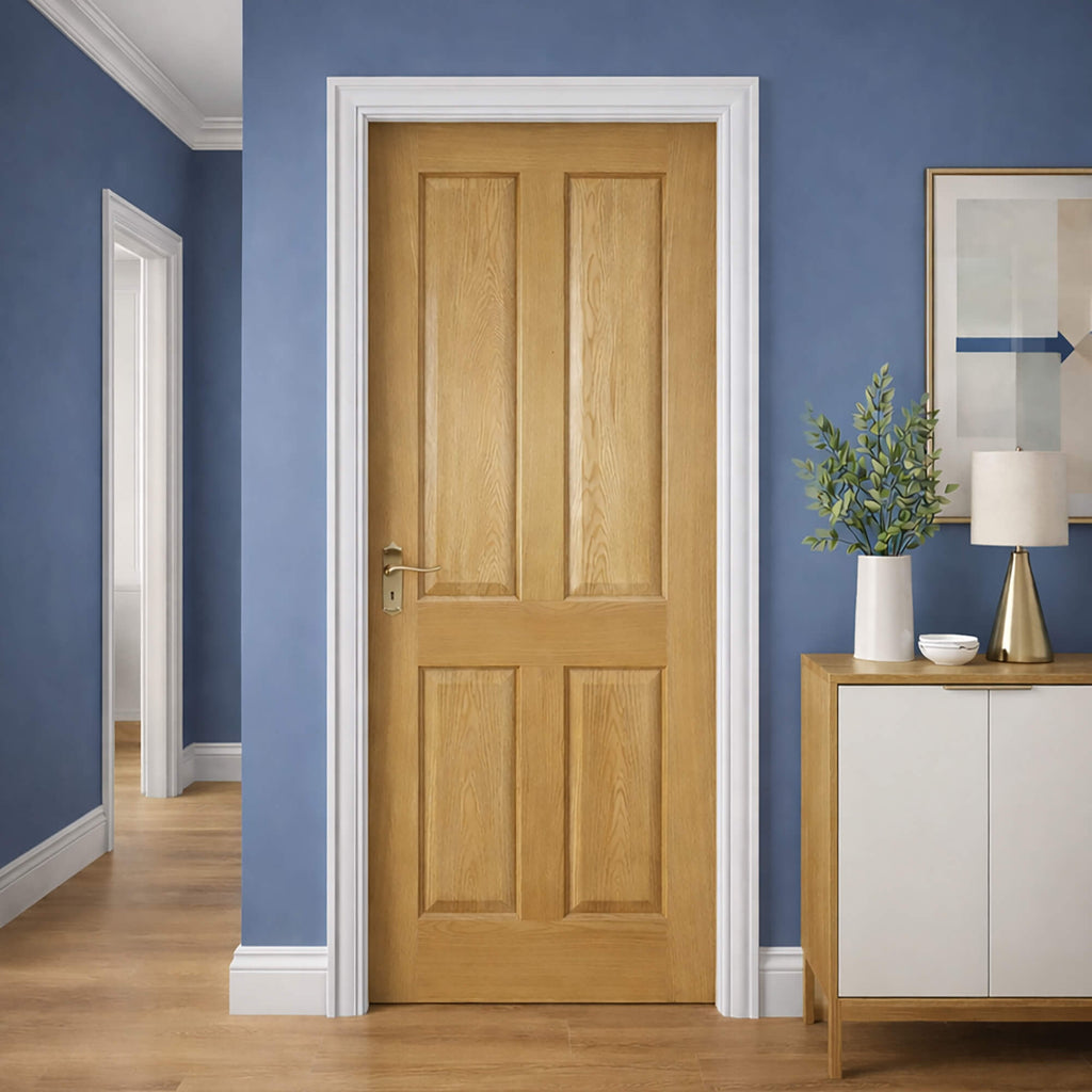 A 4 Panel White Oak Internal Door with white architrave in a home interior setting