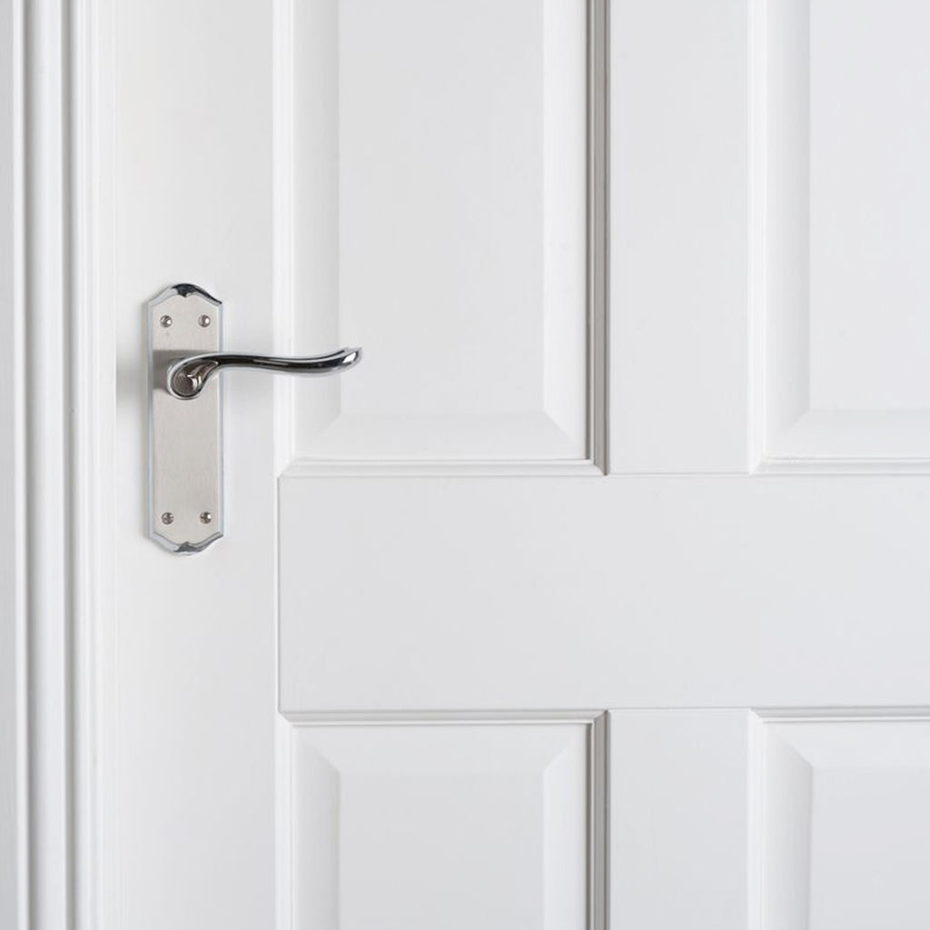 A close-up of a 4 Panel White Primed Door showing the grooved panels.