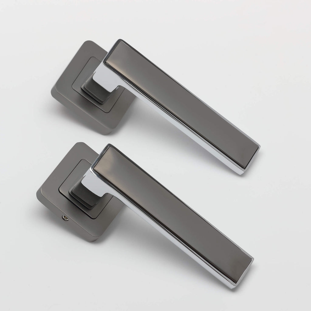 A set of Alto Matt Satin Black & Polished Chrome Square Rose Handles on a white background.