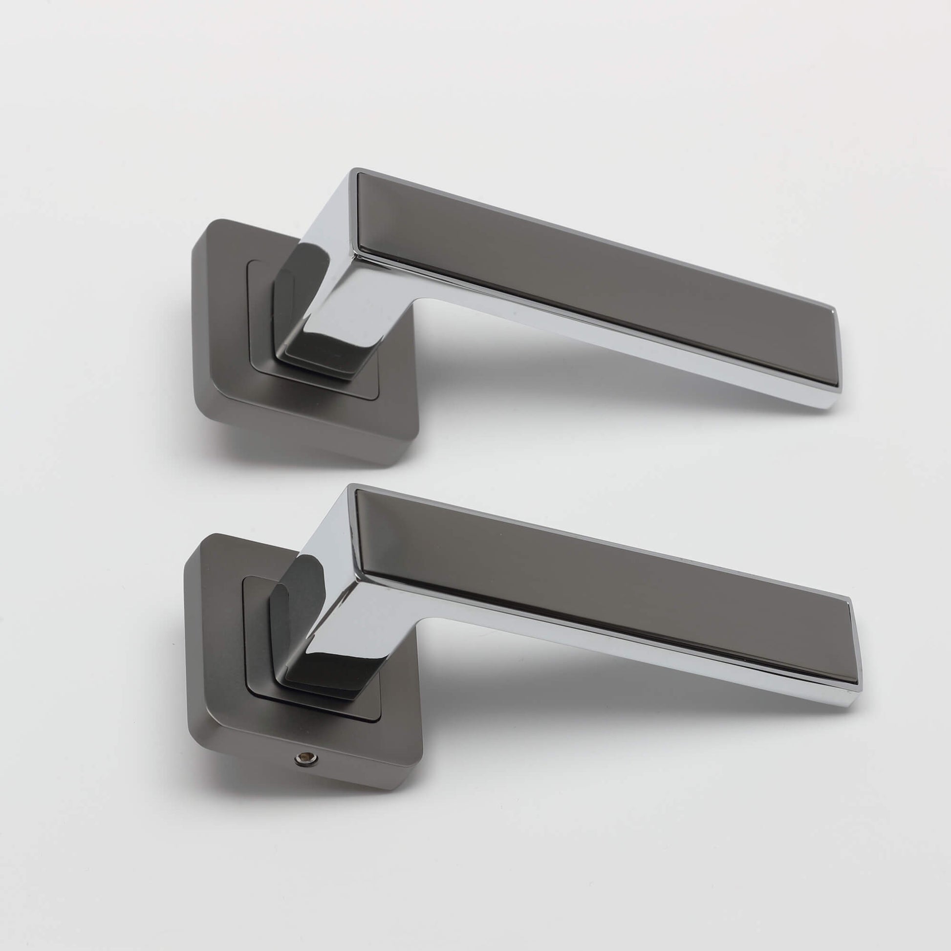 A set of Alto Matt Satin Black & Polished Chrome Square Rose Handles on a white background.