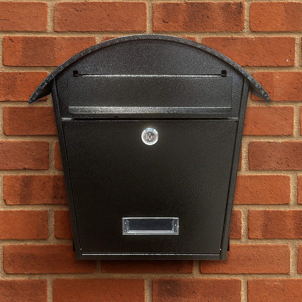 Cottage Black Letter Box mounted on a red brick wall