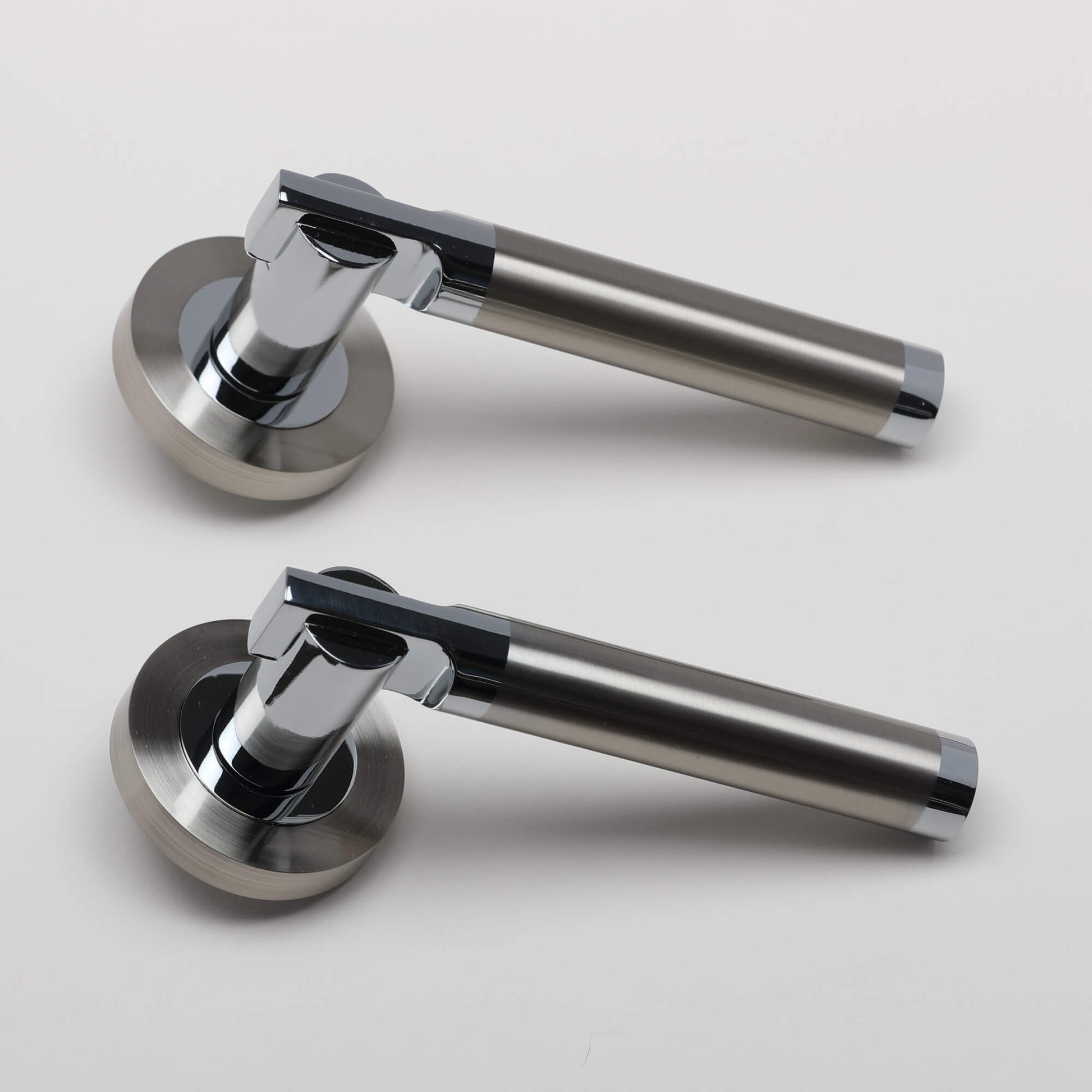 A pair of Cumulus Nickel Brushed & Polished Chrome Handles on a light grey background.