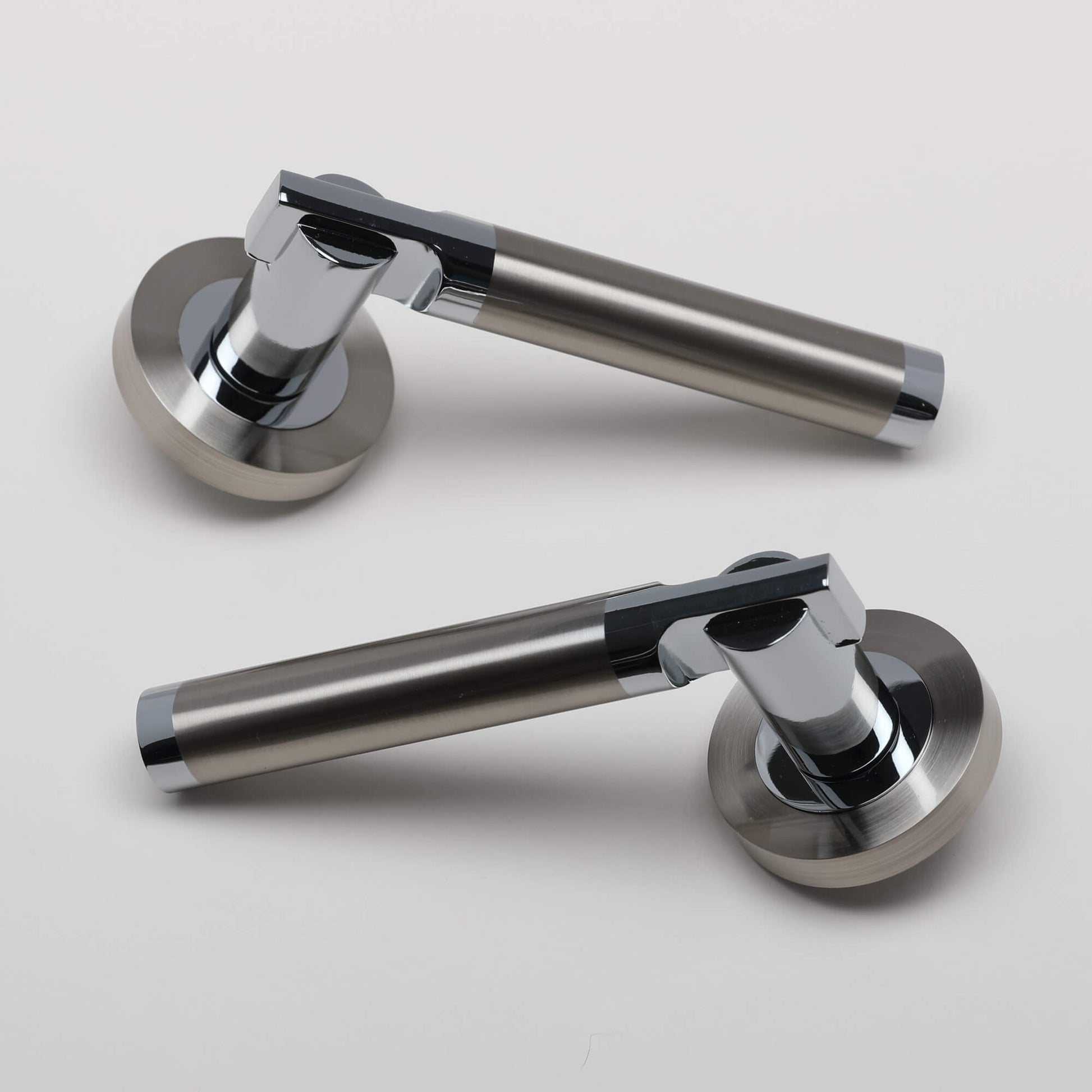 A pair of Cumulus Nickel Brushed & Polished Chrome Handles on a light grey background.