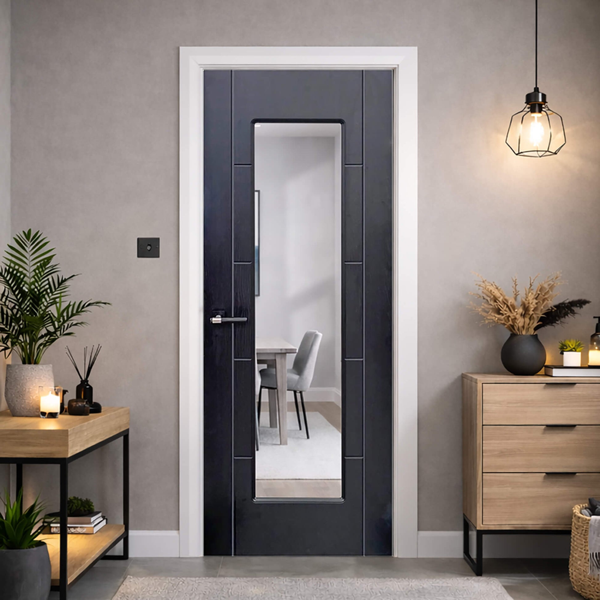An Iseo Black Ash 1 Lite Pre-Glazed Laminate 35mm Internal Door in a modern home setting looking into a dining room.