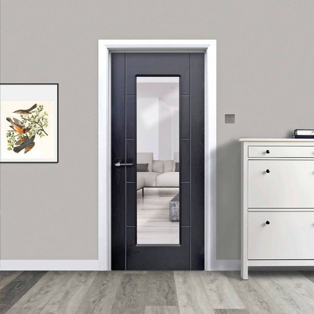 An Iseo Black Ash 1 Lite Pre-Glazed Laminate 35mm Internal Door in a home setting looking into a living room.