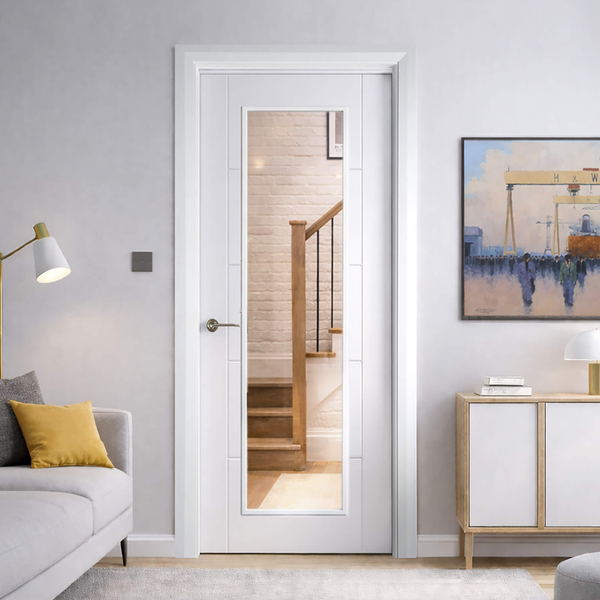 An Iseo Primer Plus 1 Lite  Internal Door in a home interior living room setting  featuring a mirror, grey sofa, and wooden side table.