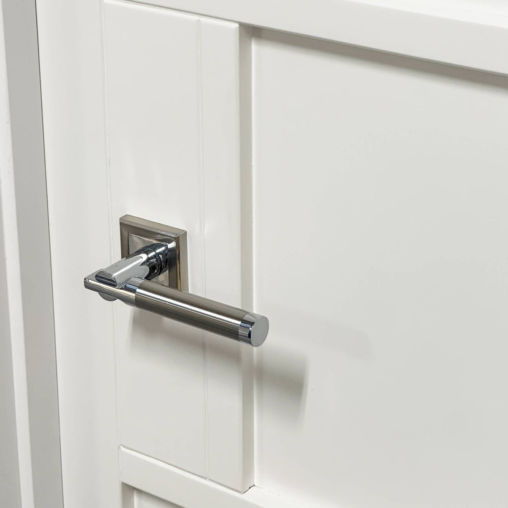 Close-up of a Cumulus door handle on a Kew White Primer Plus 5 Panel Door.