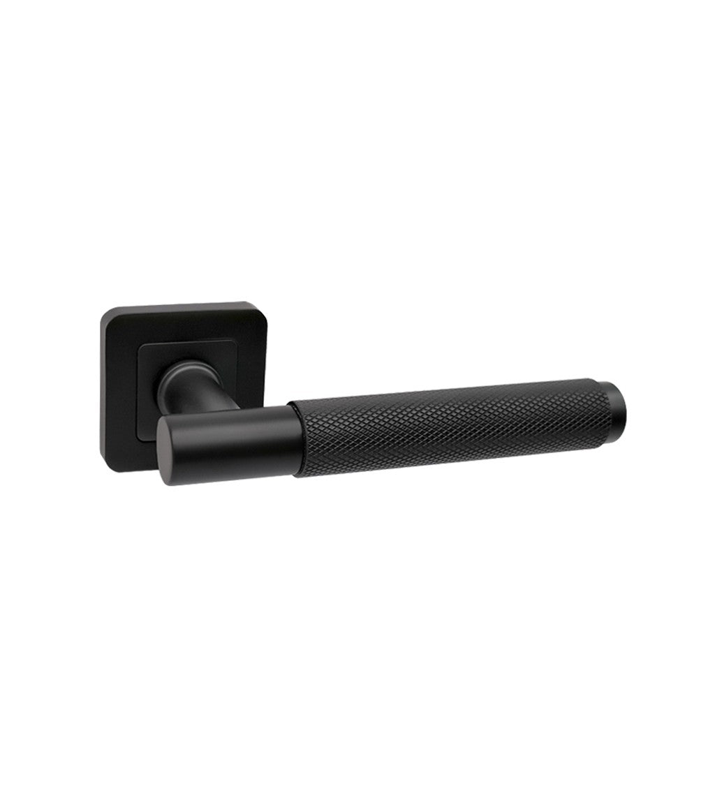 A Knurled Flat Black Square Rose door handle on a white background