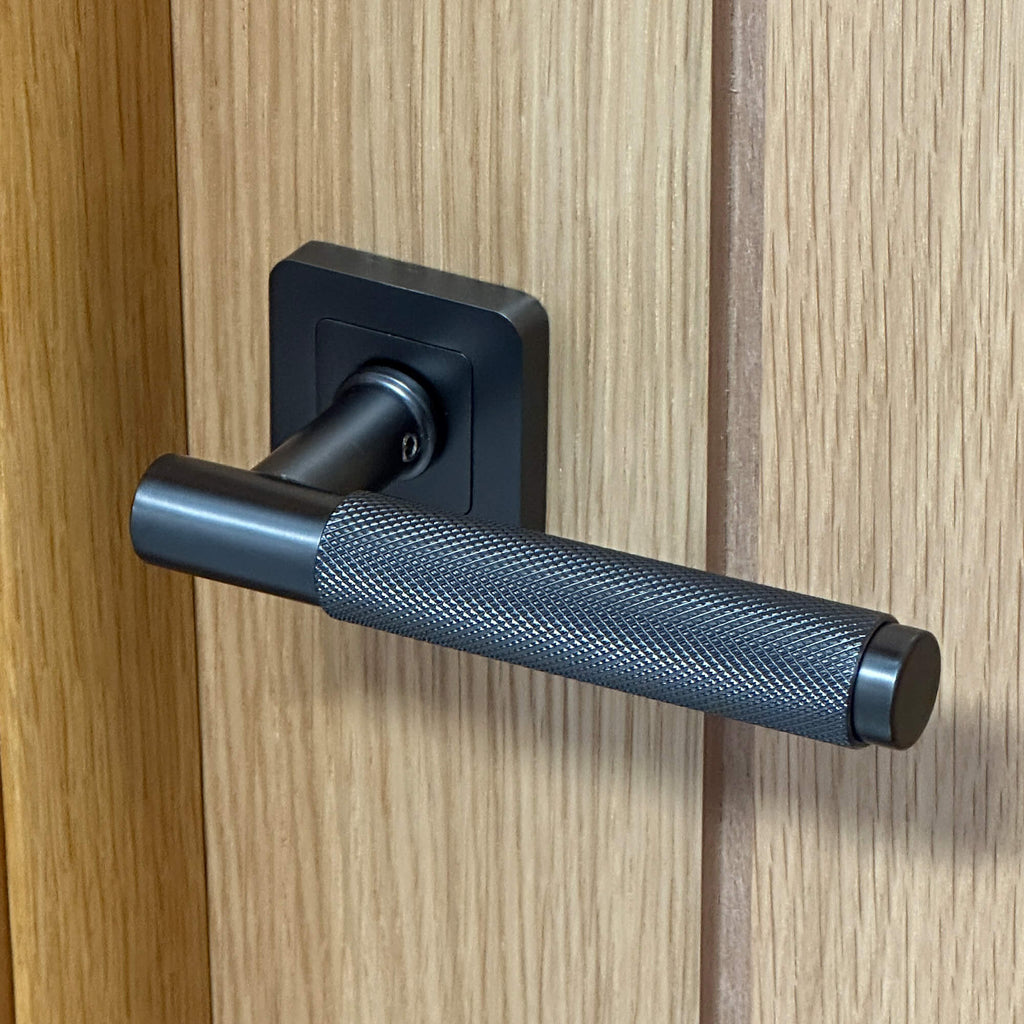 A close-up of a Knurled Matt Satin Black Square Rose Handle on a Mexicano Internal Door.
