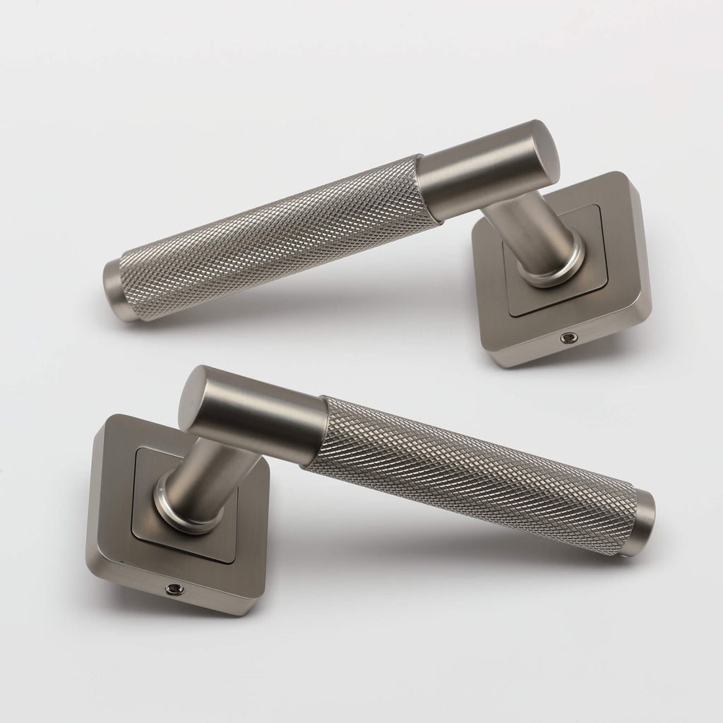 A pair of Knurled Matt Satin Nickel Square Rose Handles on a light grey background.