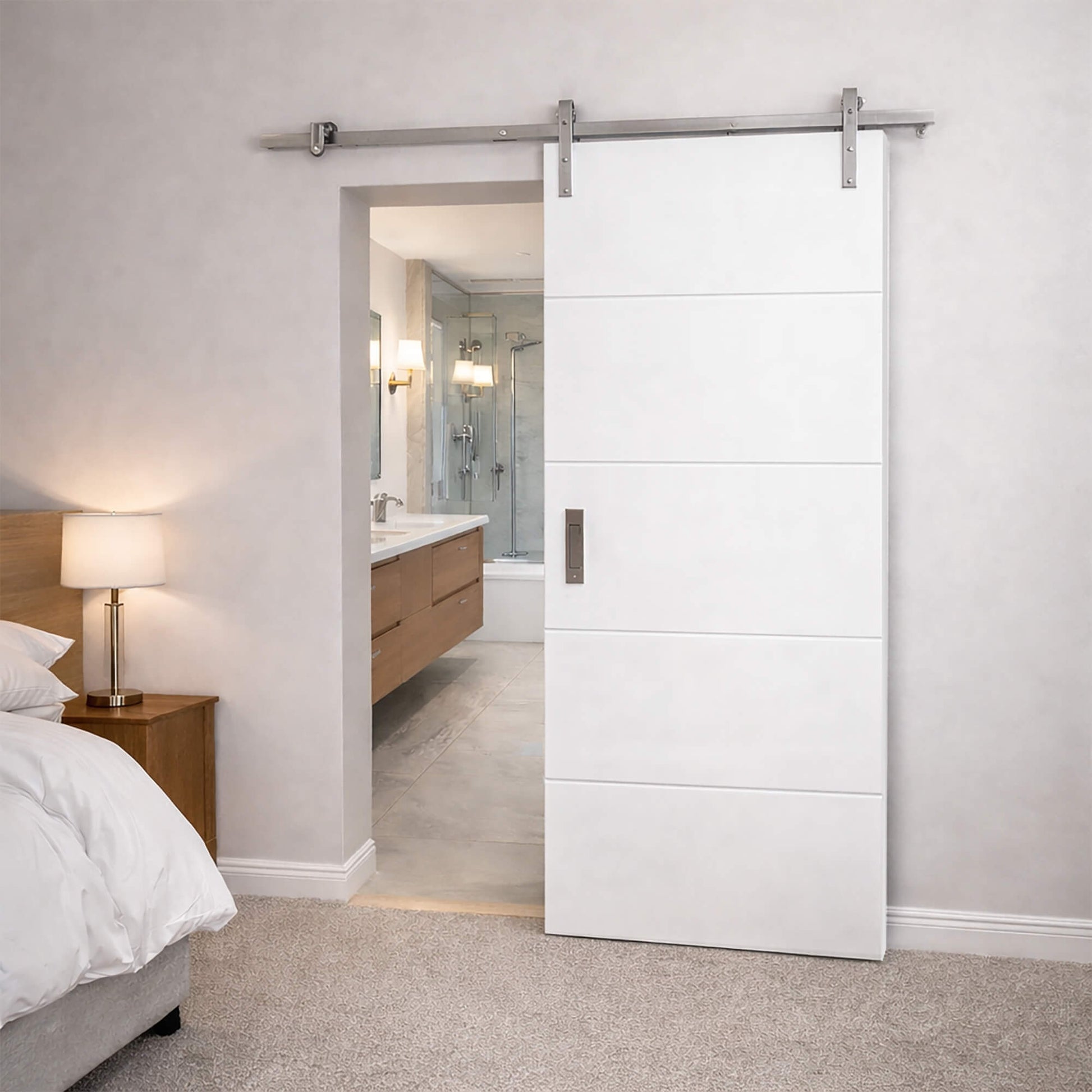 A Manhattan Sliding Barn Door with metal track, in a bedroom setting, looking into a bathroom ensuite.