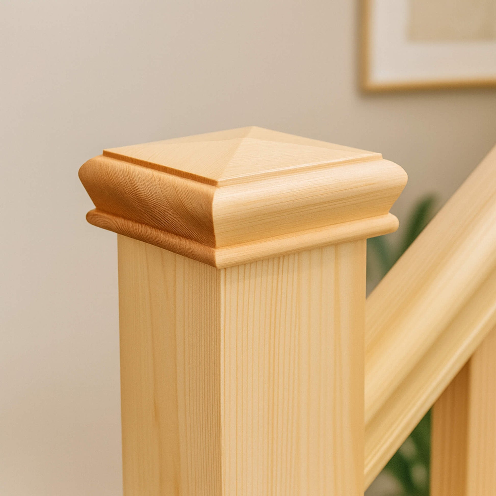 Close-up of a Redwood Pine Pyramid Newel Cap against a neutral background.