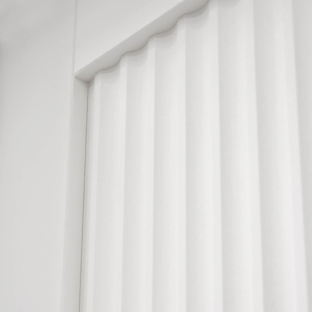 Close-up of a white of a Reeded White Primed 35mm Internal Door.