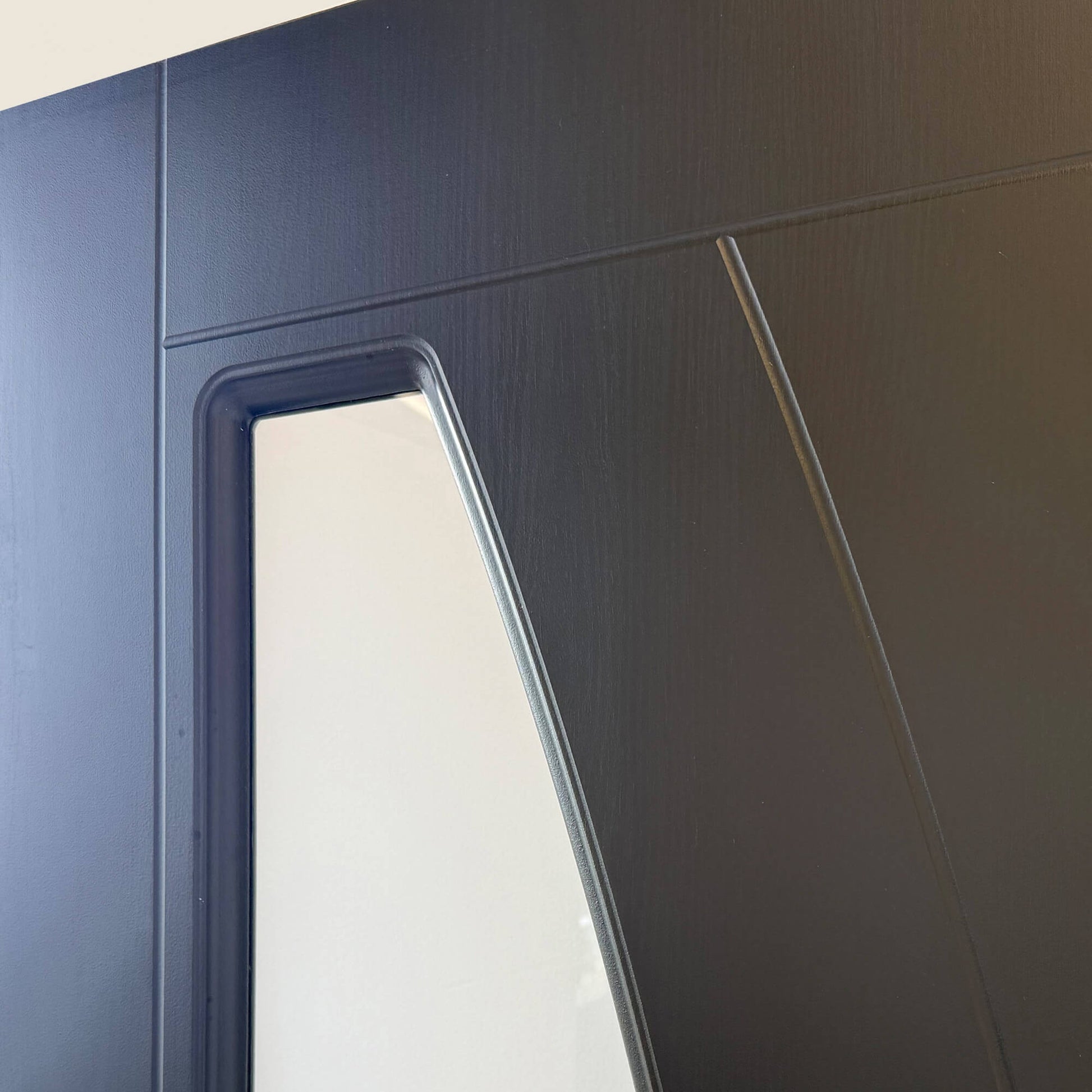 Close-up of the 4mm toughened glass panel on a Salerno Black Ash 35mm 1 lite laminate door.