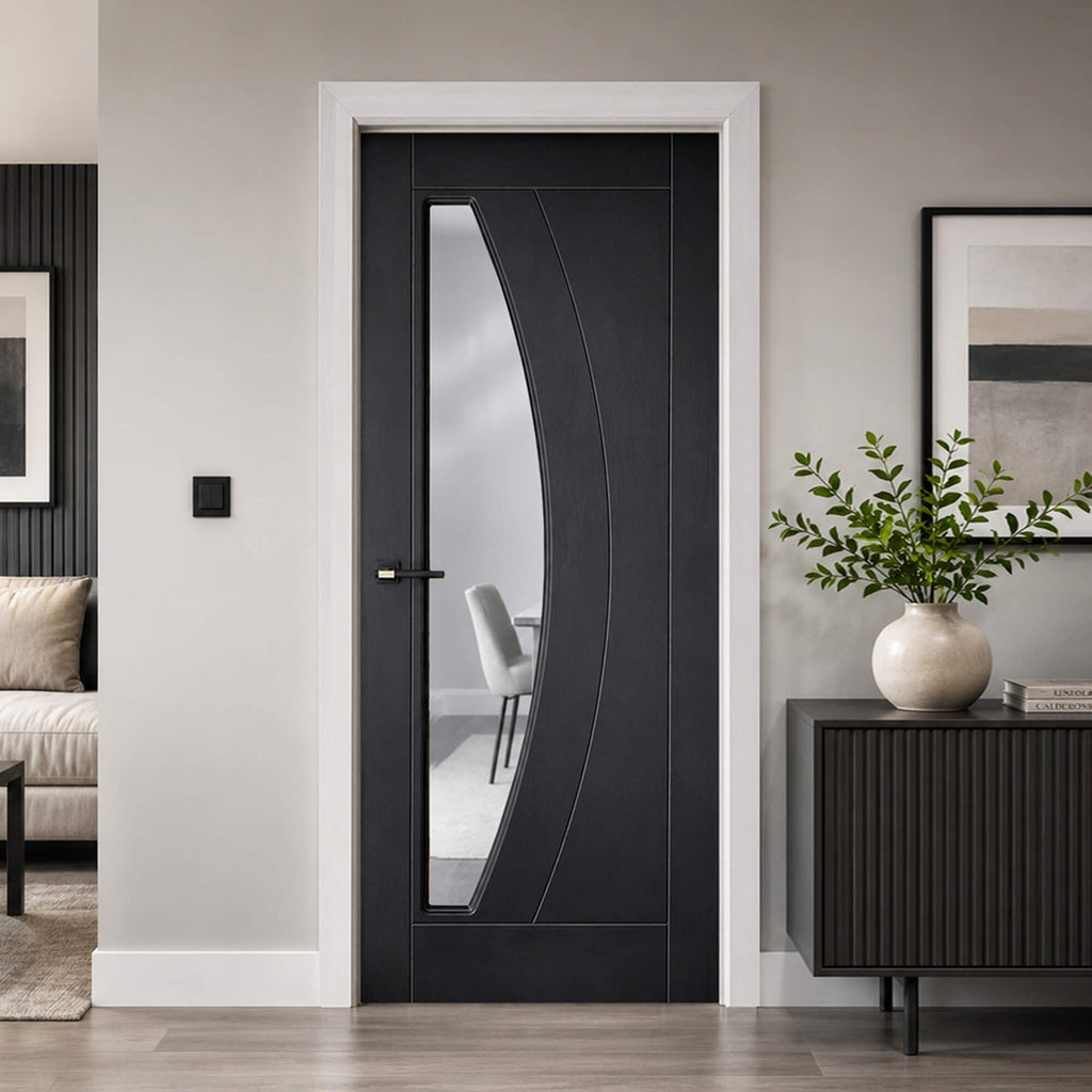 Modern Salerno Black Ash 35mm laminate 1 lite pre-glazed door in a stylish apartment setting.