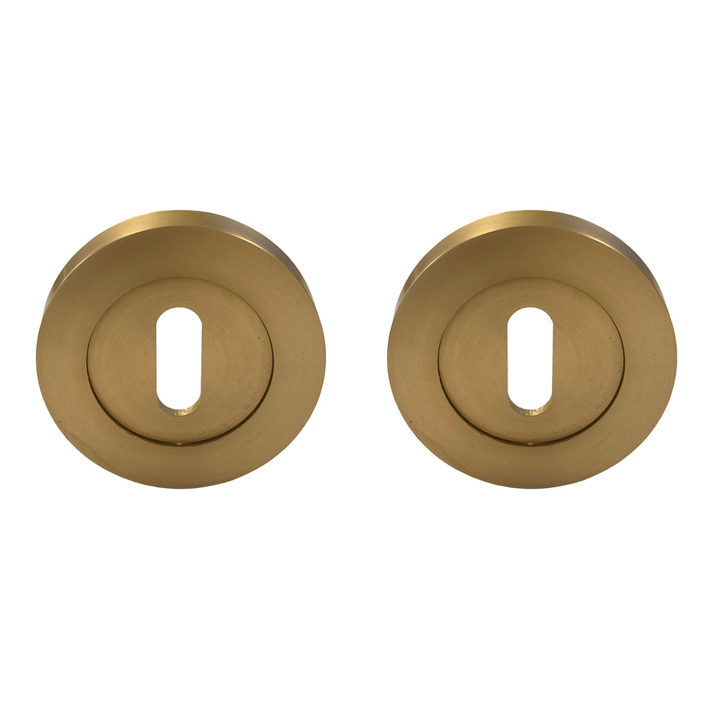 A pair of Satin Brass Round Escutcheons on a white background