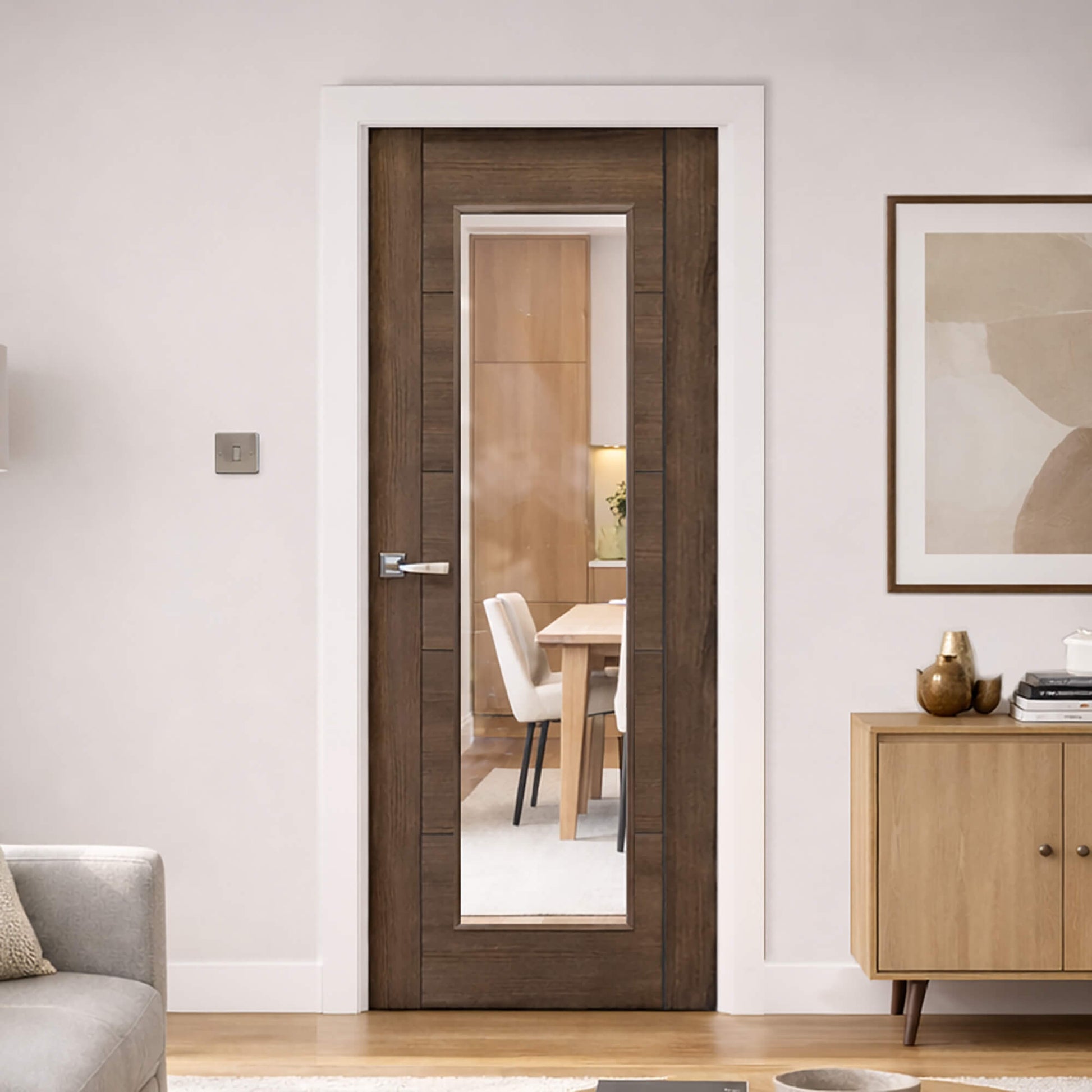 A Tigris Walnut 1 Lite Unglazed Laminate Door, with clear toughened glass inserted, with a Tempest handle in a modern home interior setting.