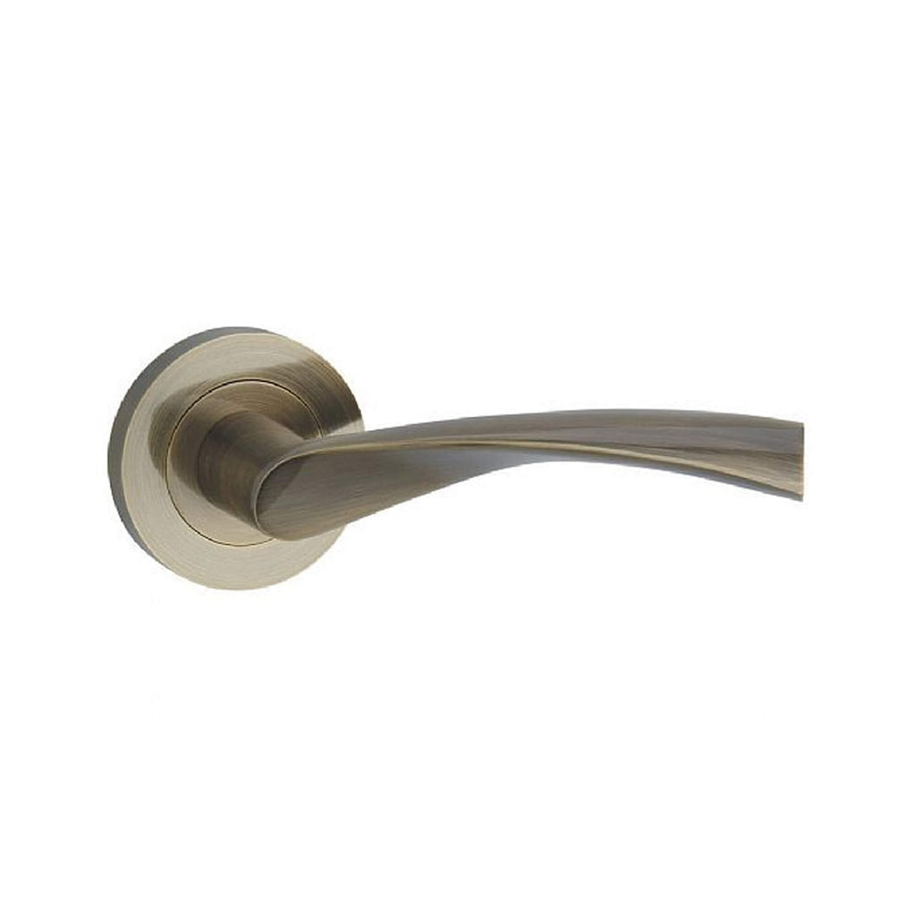 A Trade Range Antique Brass door handle on a white background