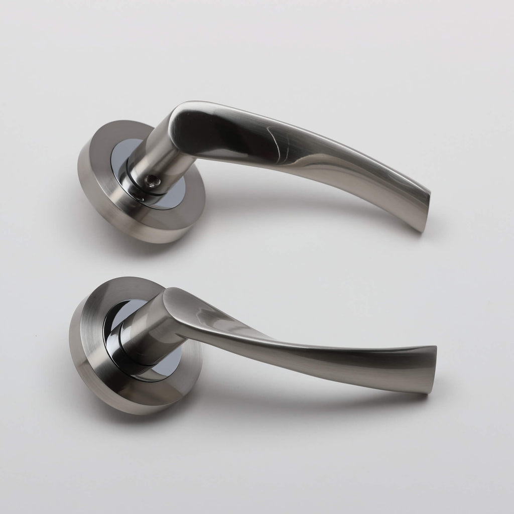 A side view of a set of Trade Range Nickel Brushed & Polished Chrome door handles on a white background.