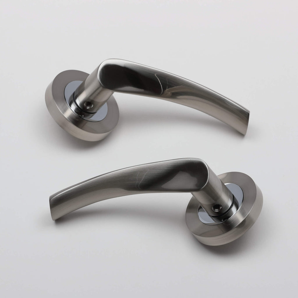 A set of Trade Range Nickel Brushed & Polished Chrome door handles on a white background.