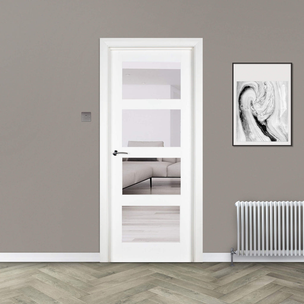 A Trade Spec White Primed Contemporary 4 Lite Pre-Glazed Clear 40mm Internal Door in a home setting.