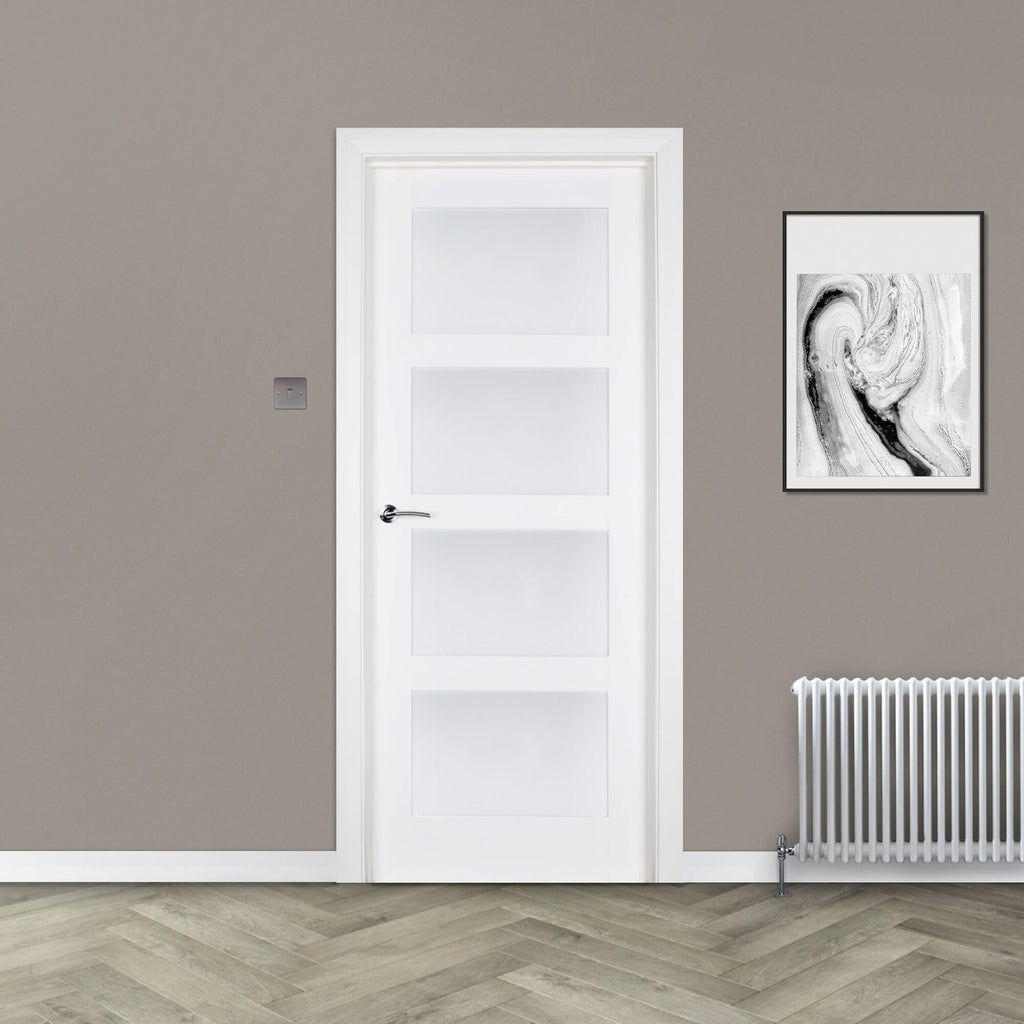 A Trade Spec White Primed Contemporary 4 Lite Sandblasted 40mm Internal Door in a home setting.