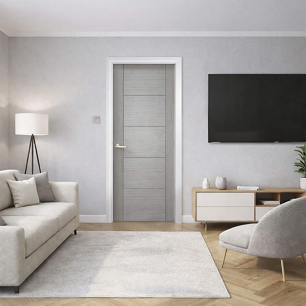 A A Vancouver Urban Grey 35mm Internal Laminate Door, with a Knurled Satin Brass Handle, in a wide view of a modern home interior setting.