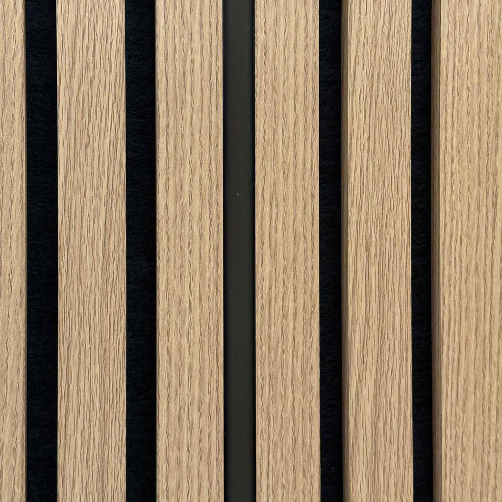 Close up of an unlit Warm White silicone LED light tube in acoustic slatwall 