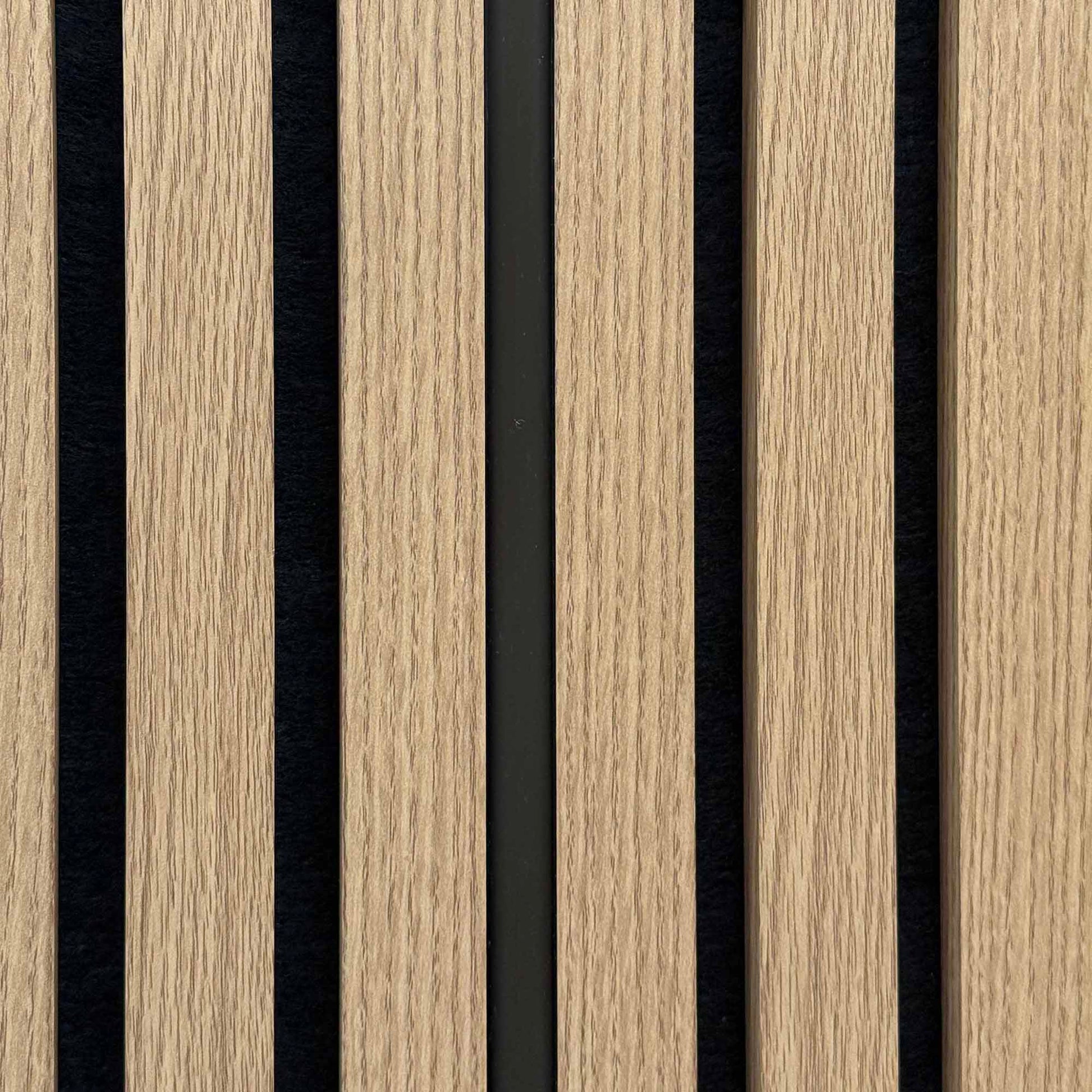 Close up of an unlit Warm White silicone LED light tube in acoustic slatwall 