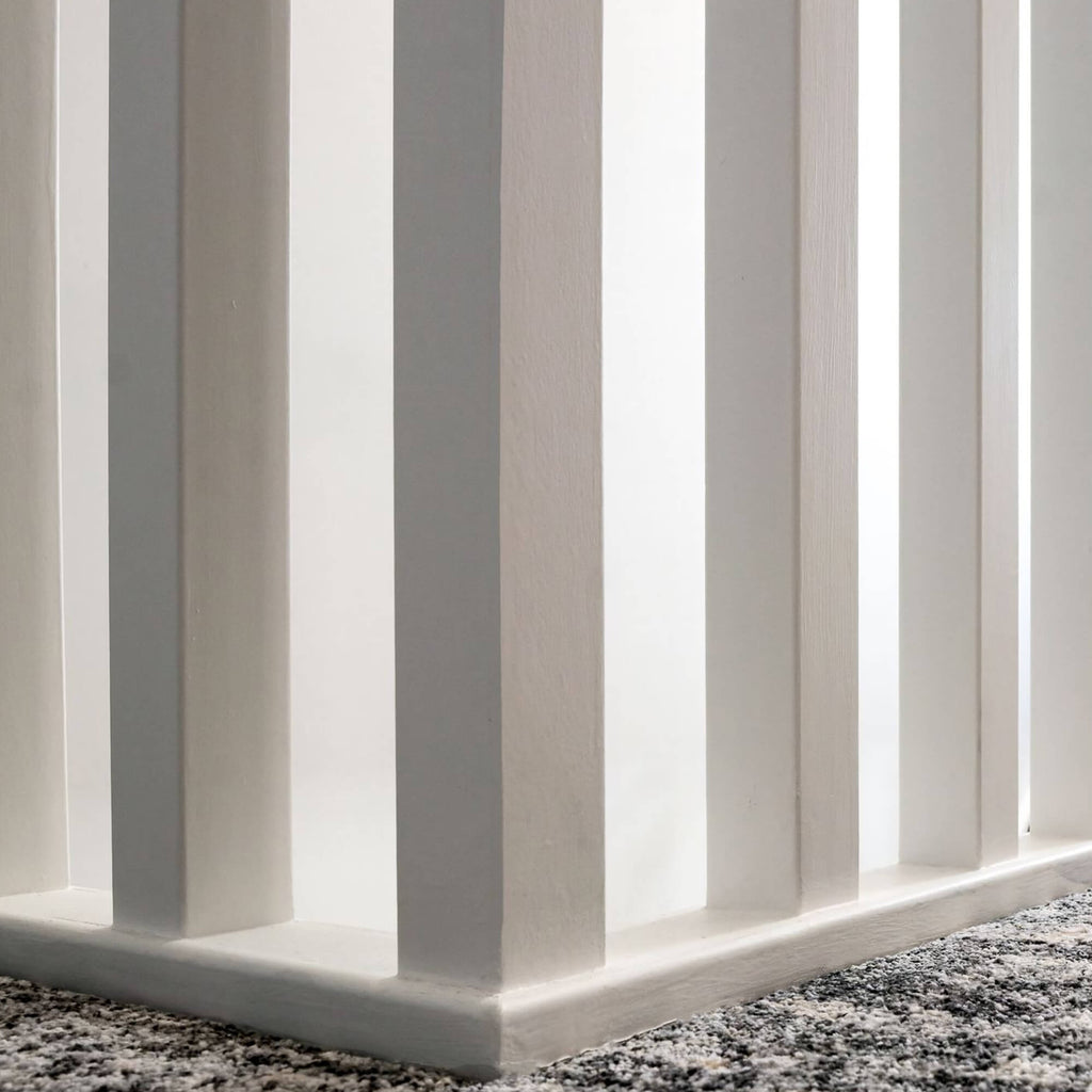Close-up of White Primed Baserail (41mm Infill) on a carpeted landing floor 